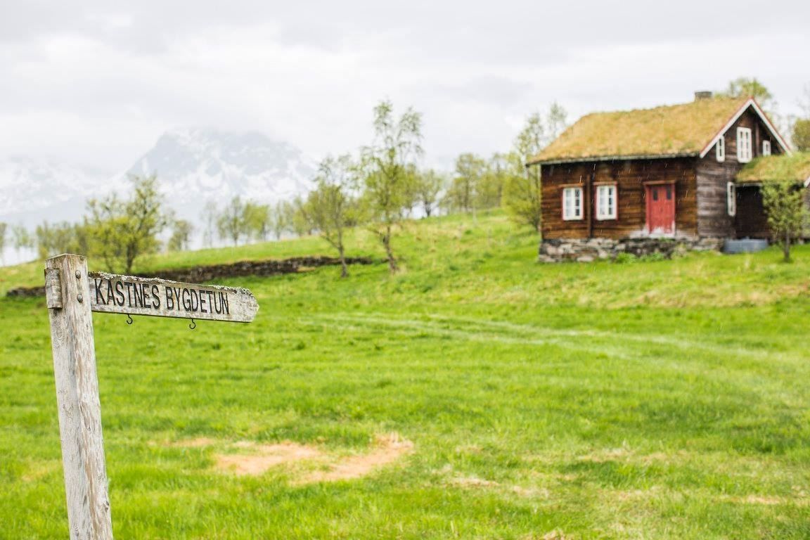 Landscape with a traditional log building.