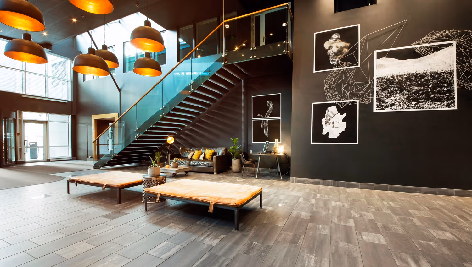 Lobby and entrance. Black-and-white art on the walls. Photo.
