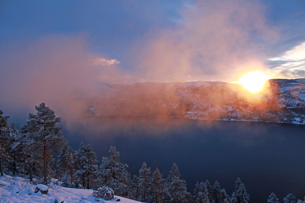 sunset over the mountains in Fyresdal in winter