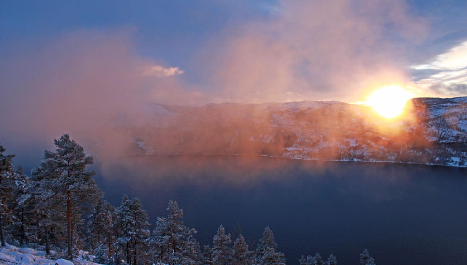 sunset over the mountains in Fyresdal in winter