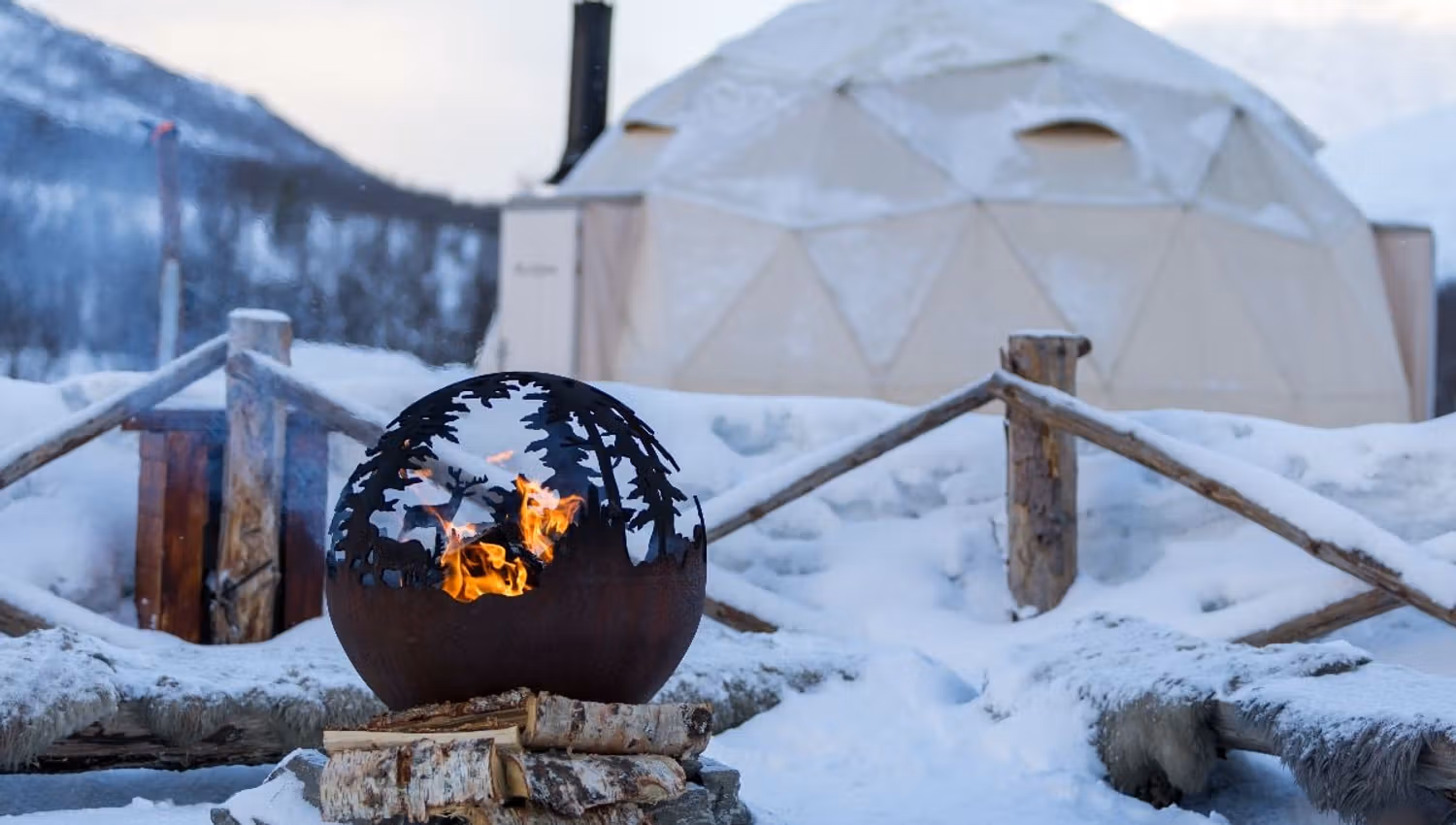A campfire in front of a tent