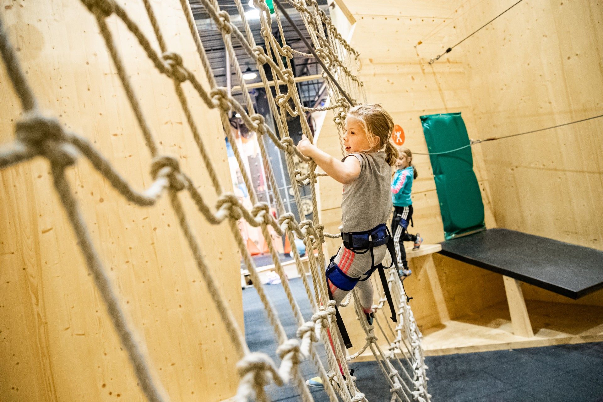 Children on a rope climbing course