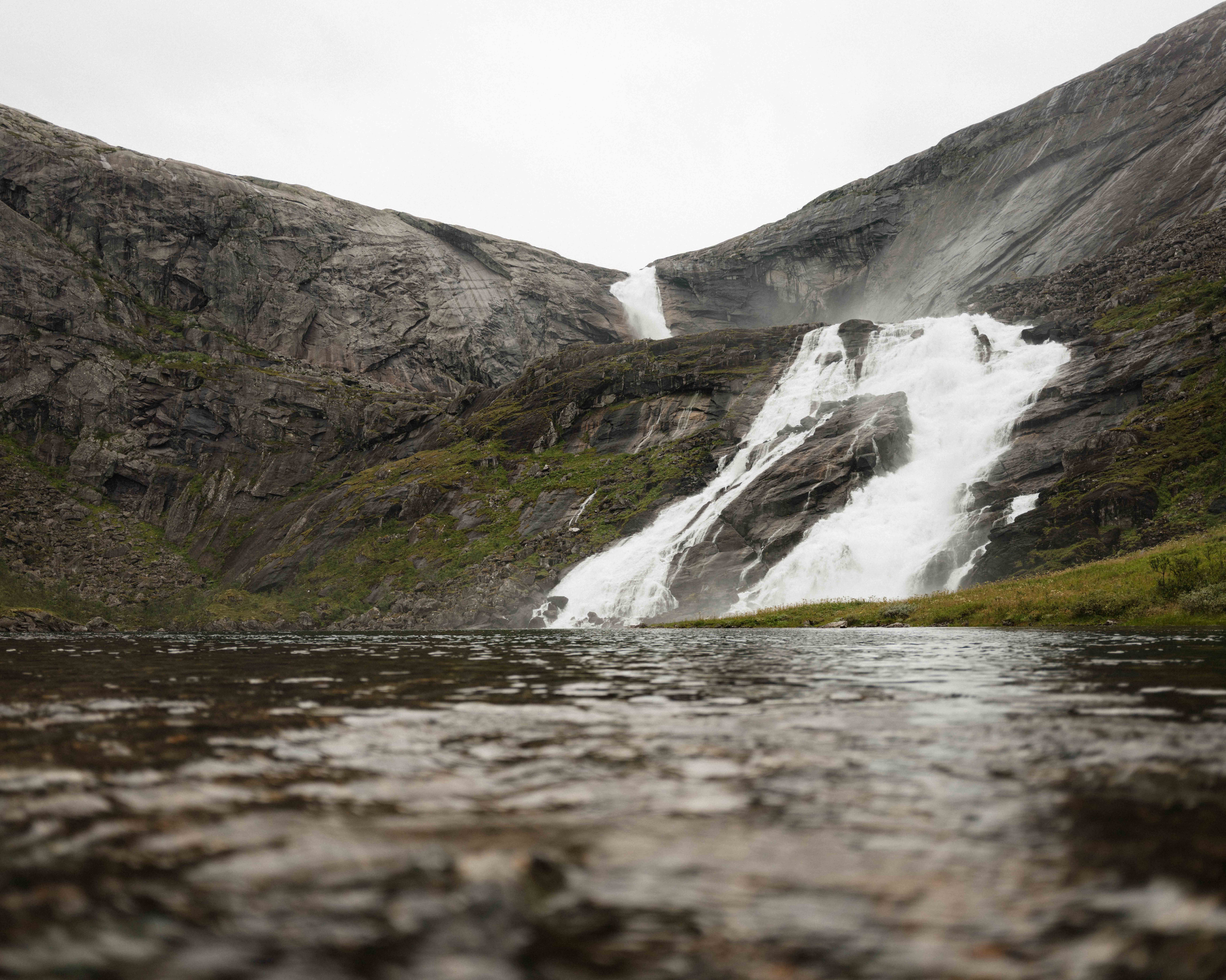 Nyastølsfossen seen from the water’s edge – raw and powerful nature.