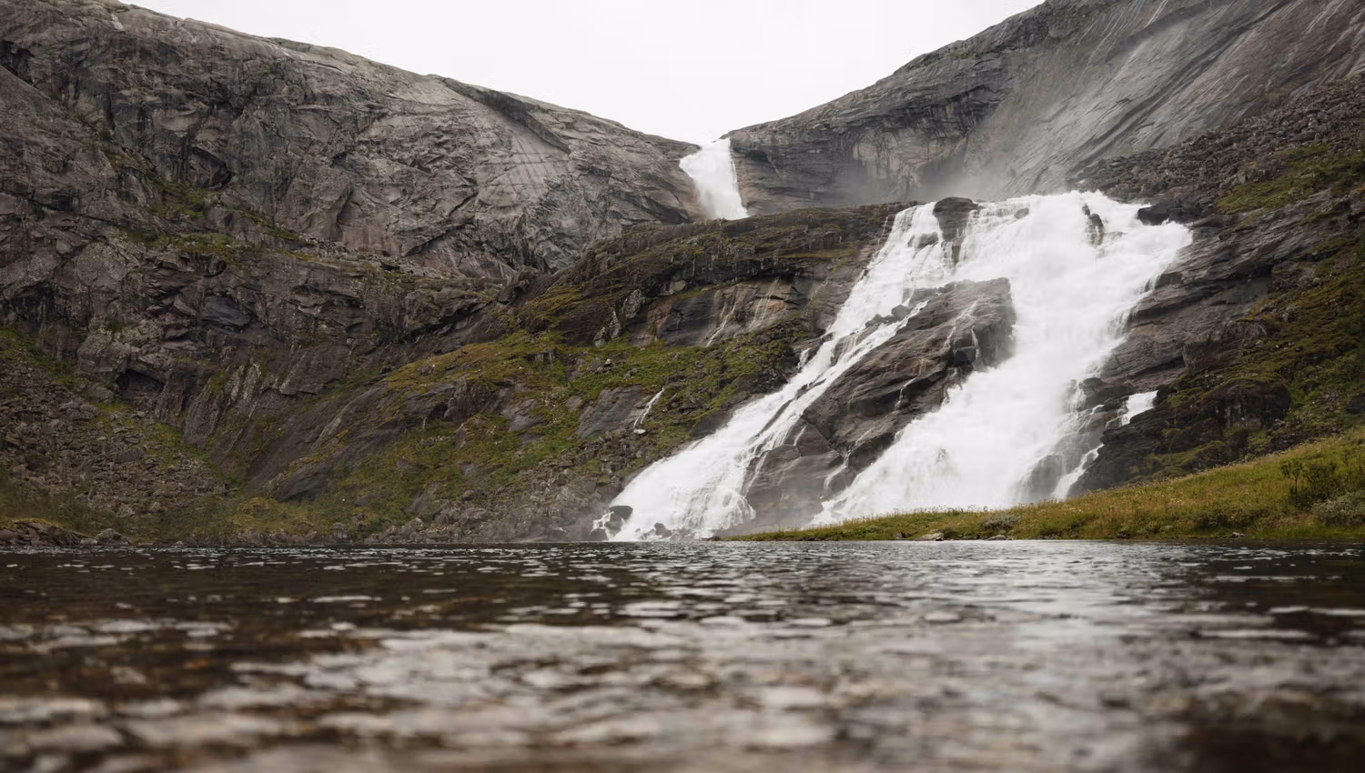 Nyastølsfossen seen from the water’s edge – raw and powerful nature.