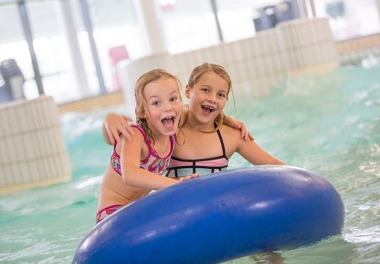 children floating on inflatable ring