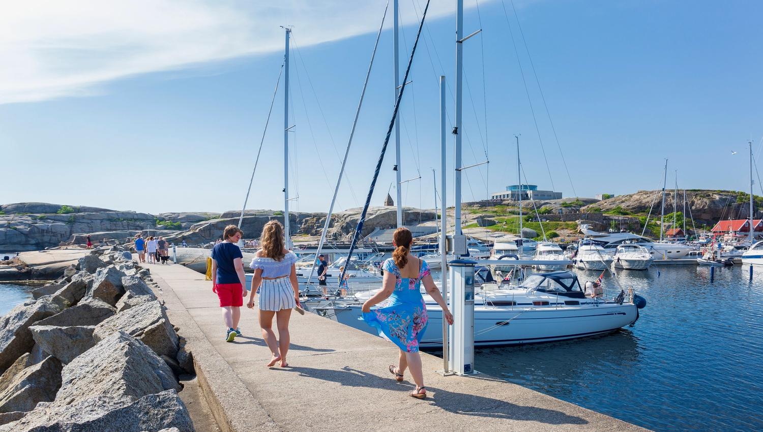 Family walks on pier