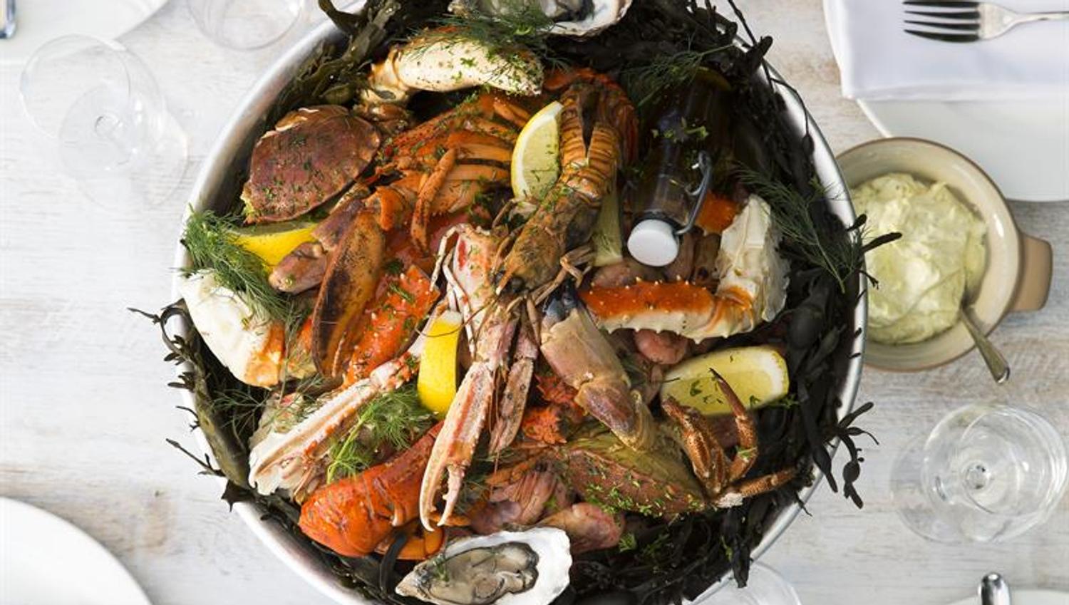 Detail photo of seafood on table set for dining.