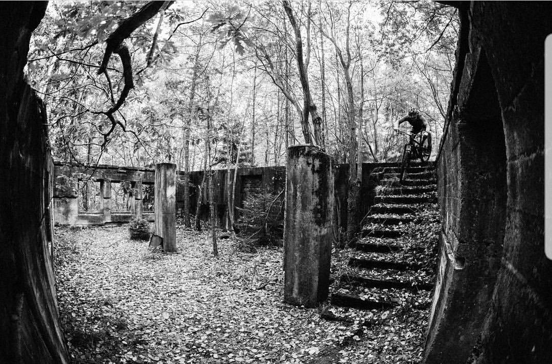 Cyclist rides down a flight of stairs