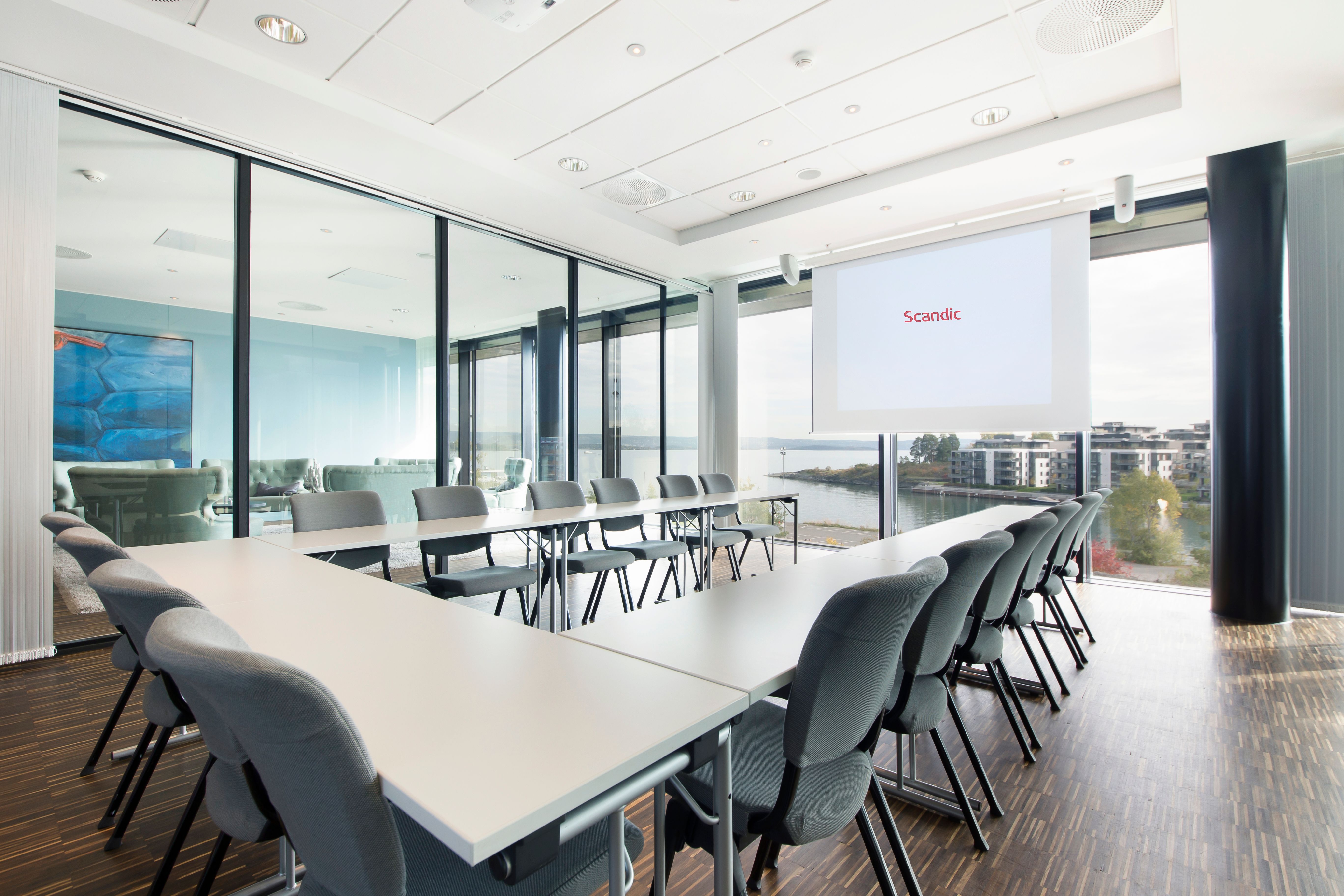 conference hall with horseshoe-setup and conference technology
