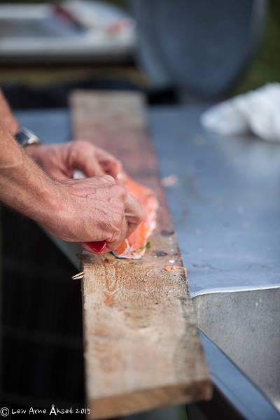 Someone filleting a piece of fish