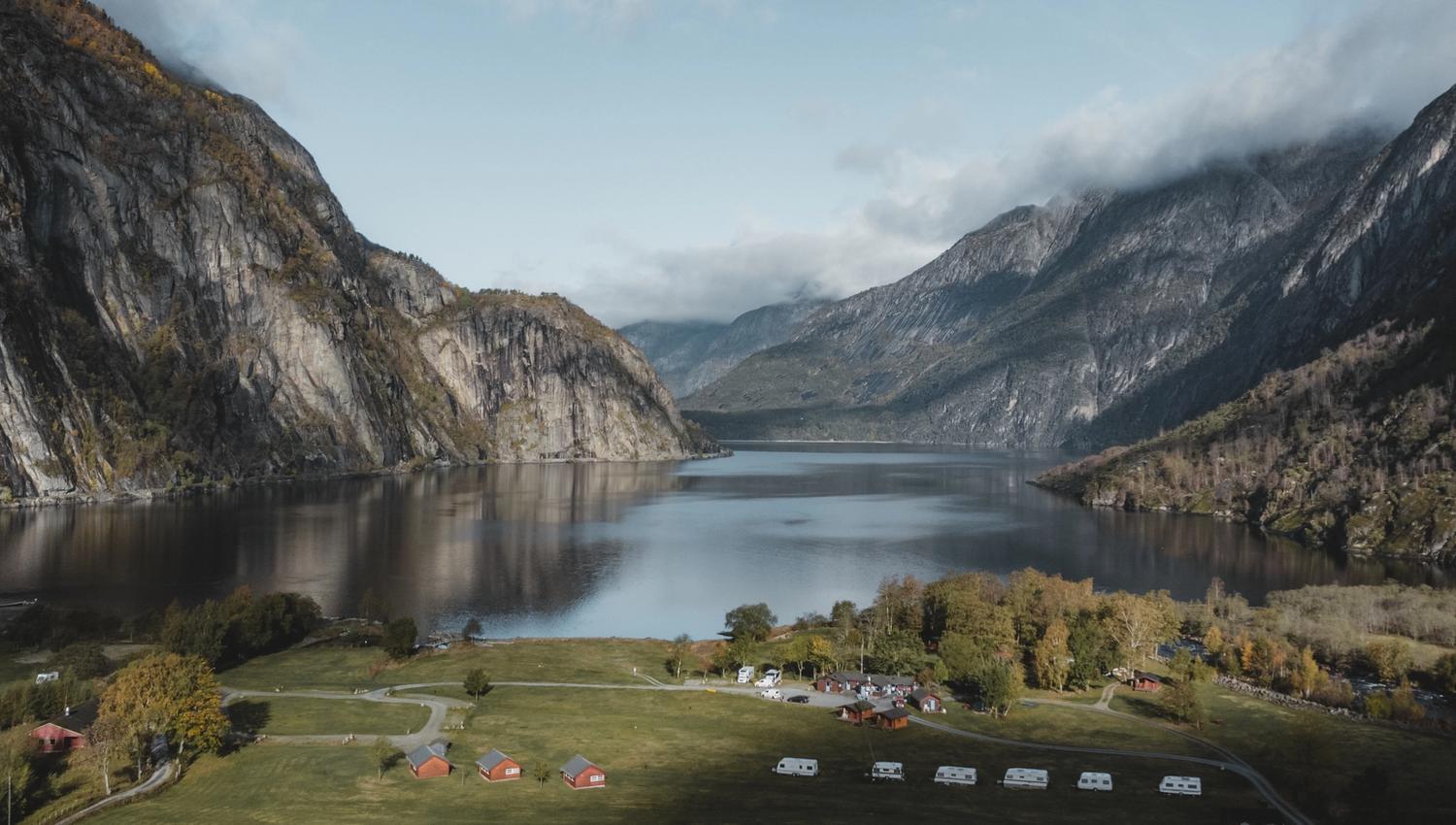 A drone photo of the campground, with the Eidfjord lake in the background.