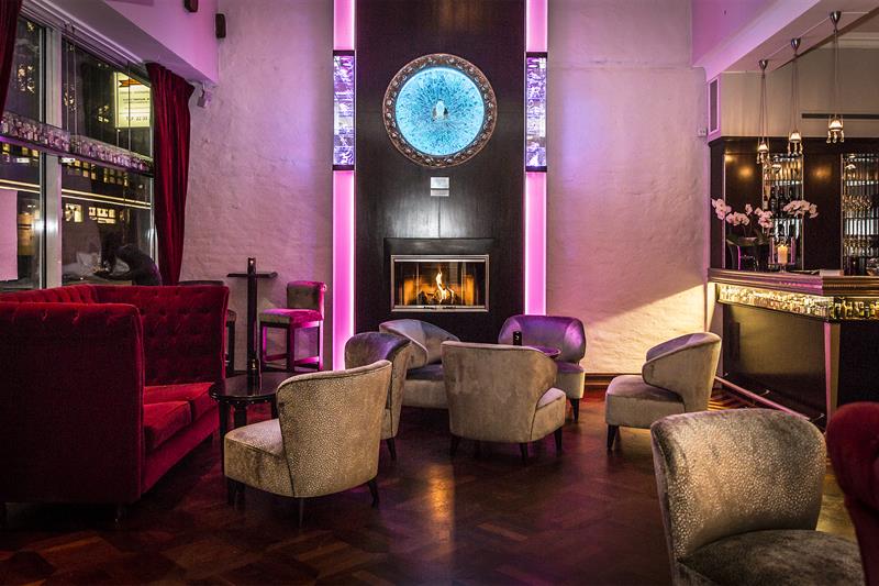Room interior with bar, sofa and armchairs