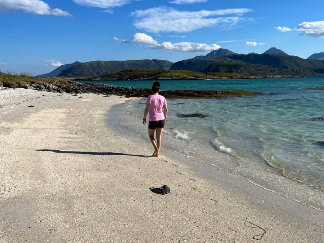 Guest walking on the beach