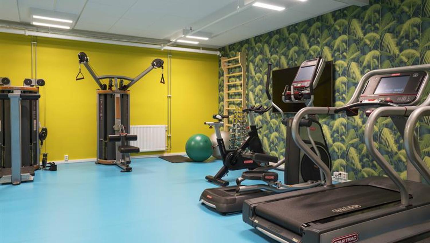 fitness room with treadmill