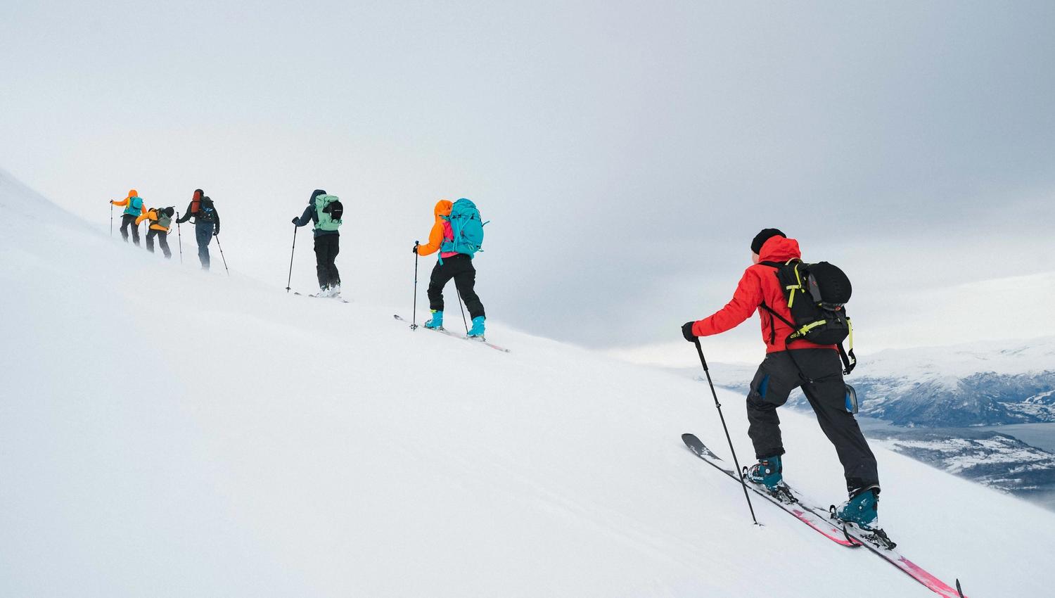 Six people randoneeing/ski touring.