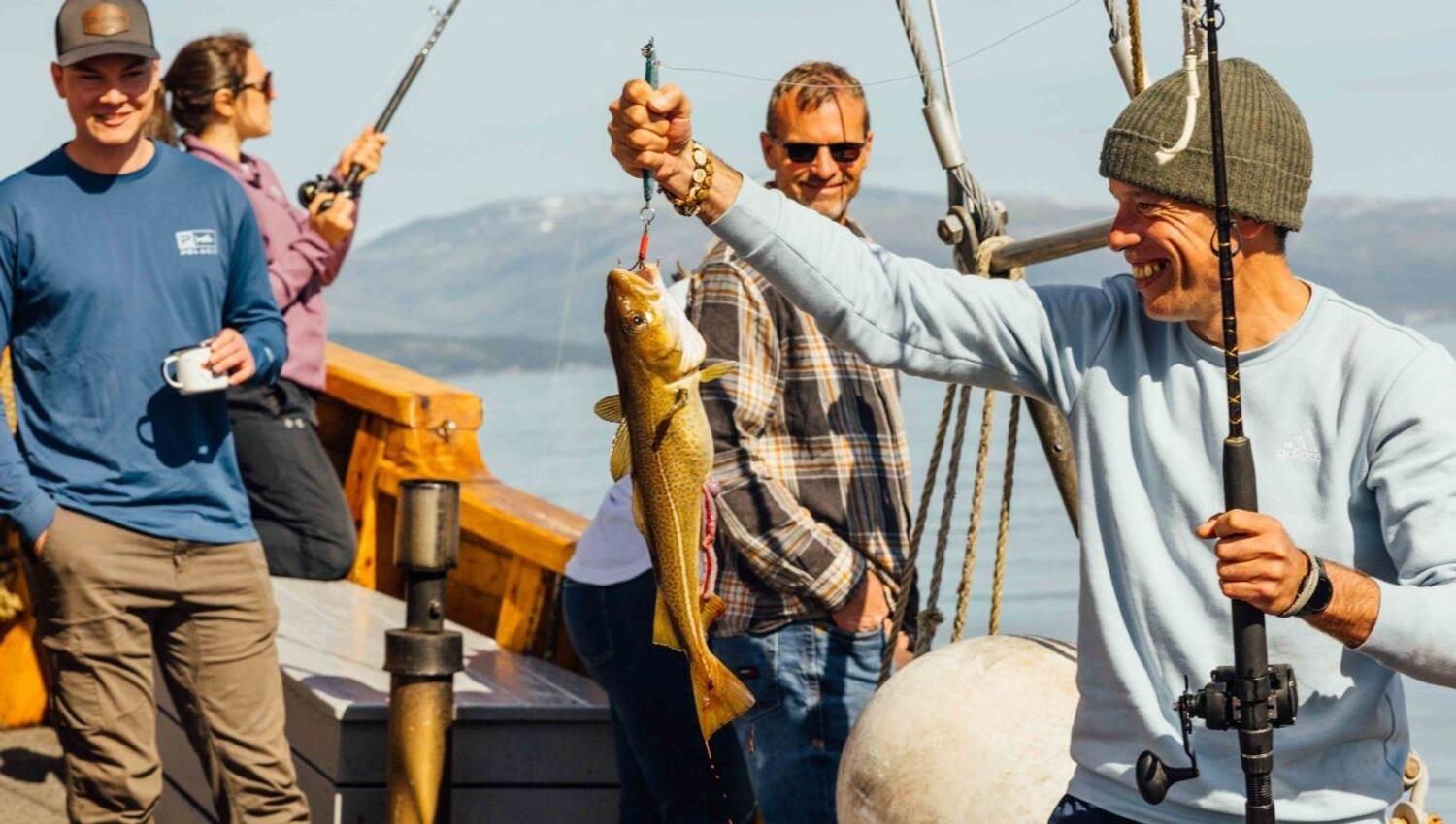 Proud guest showing their catch