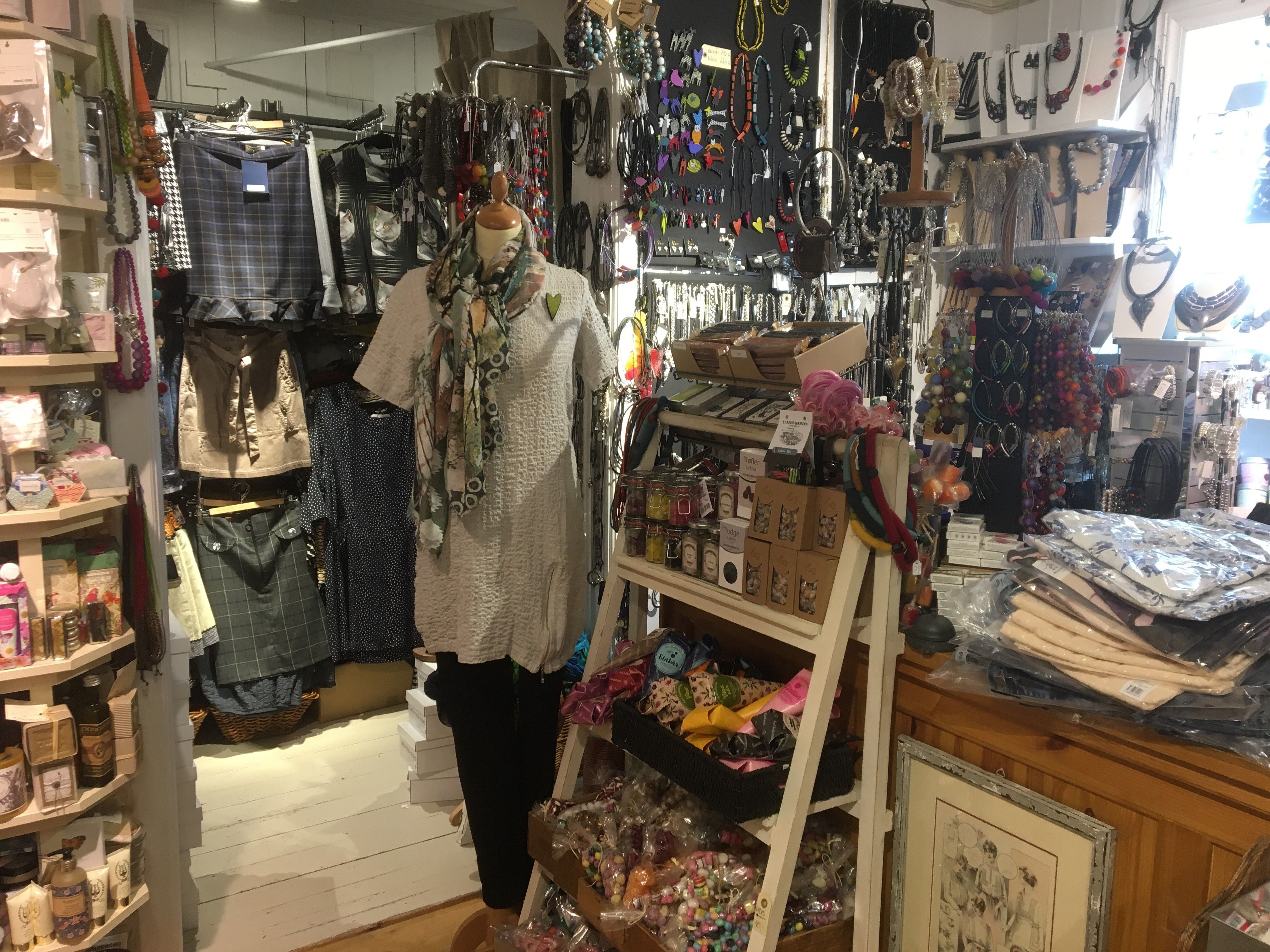 The shop is filled up to the roof with items to buy.