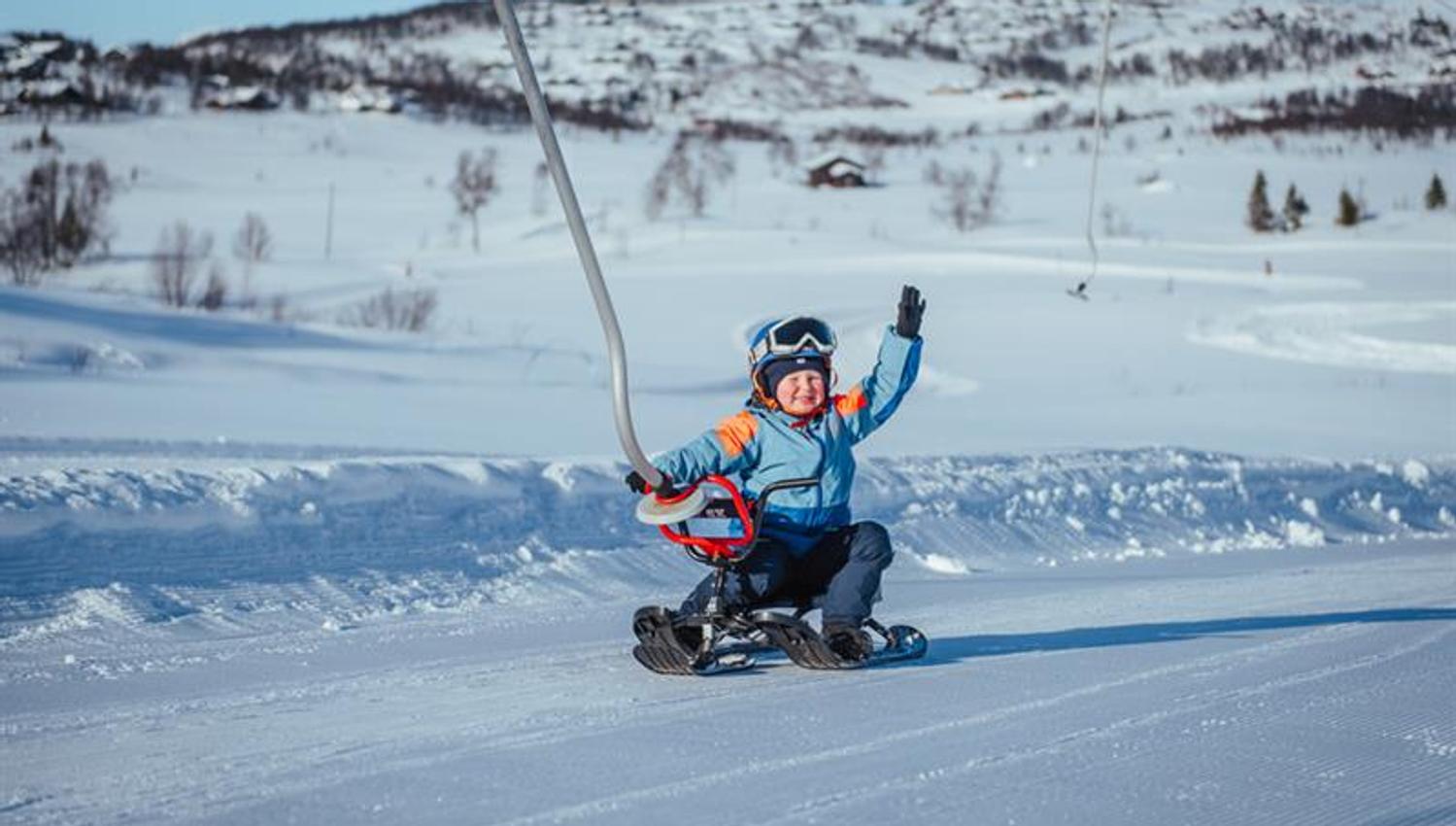 children on a toboggan at Vierli ski centre