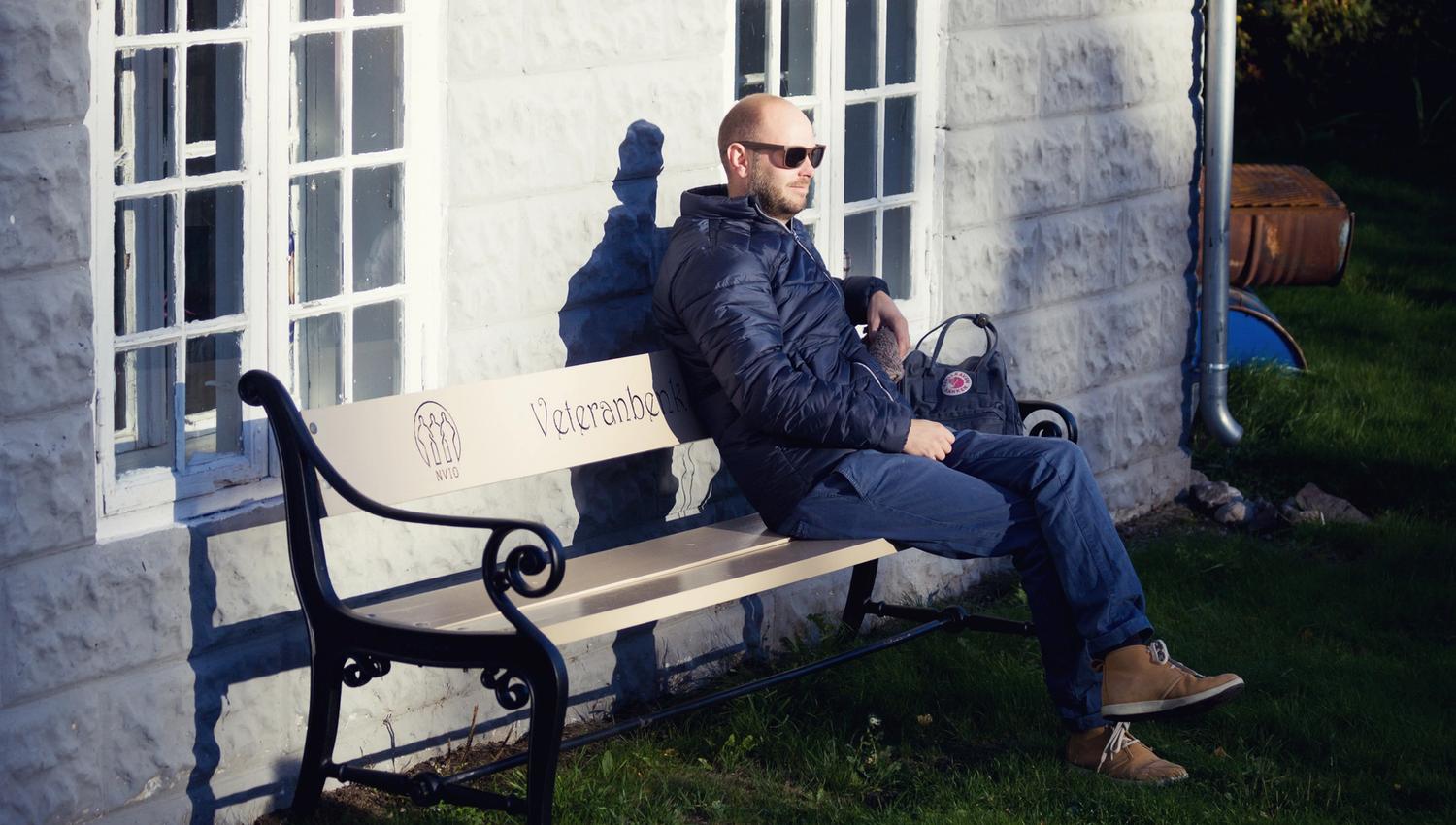 a man sitting on a bench