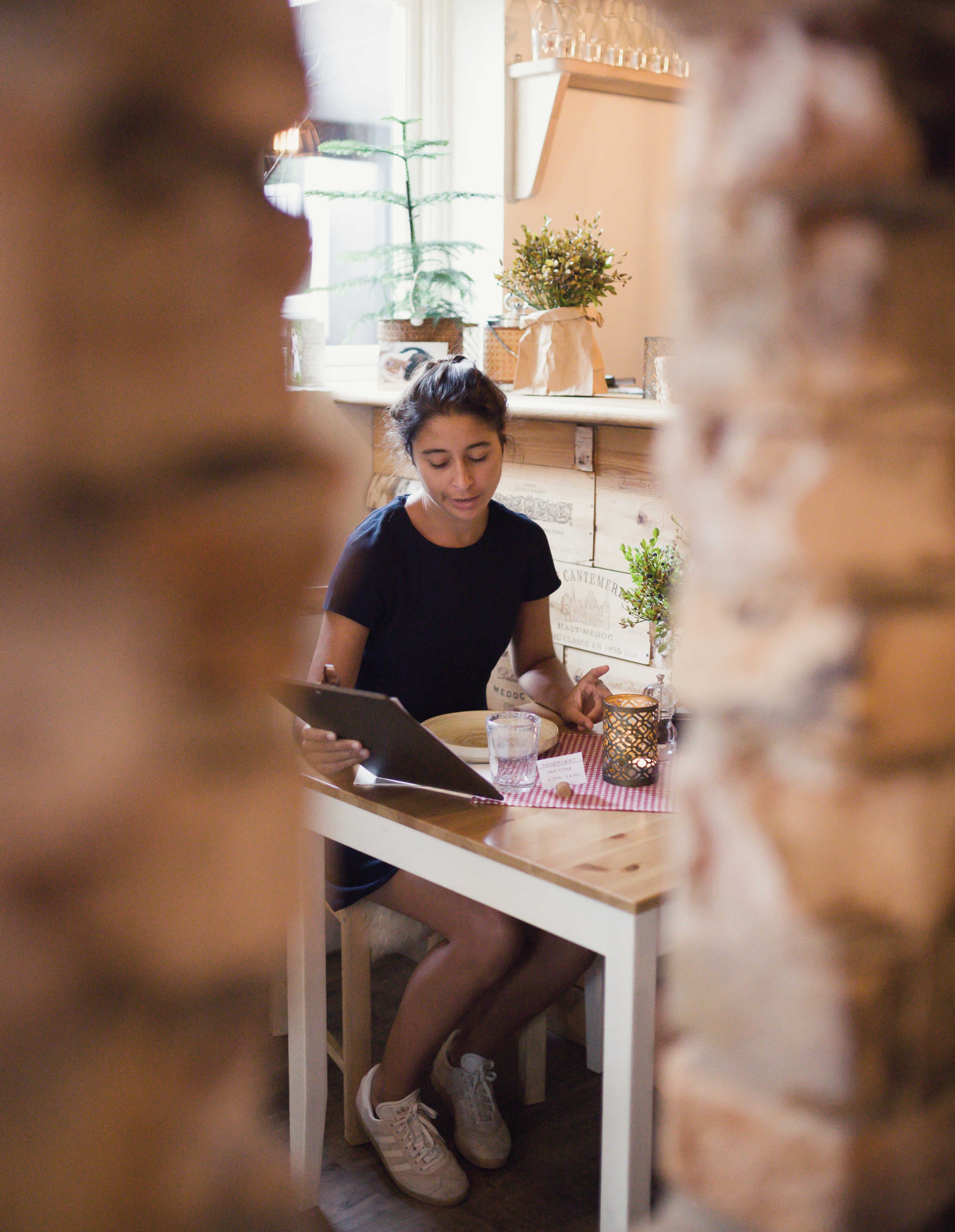 Girl looking at the menu