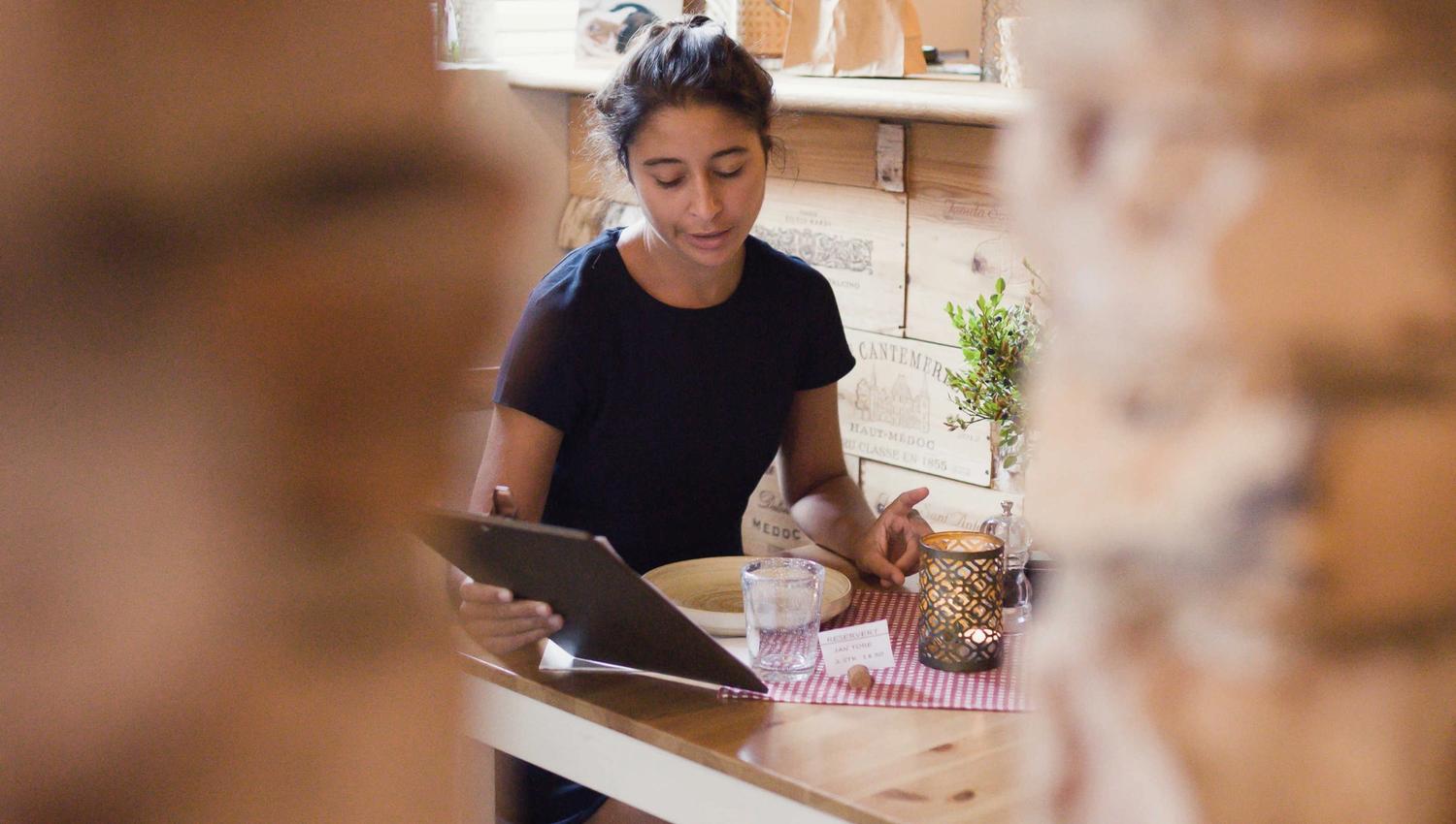 Girl looking at the menu