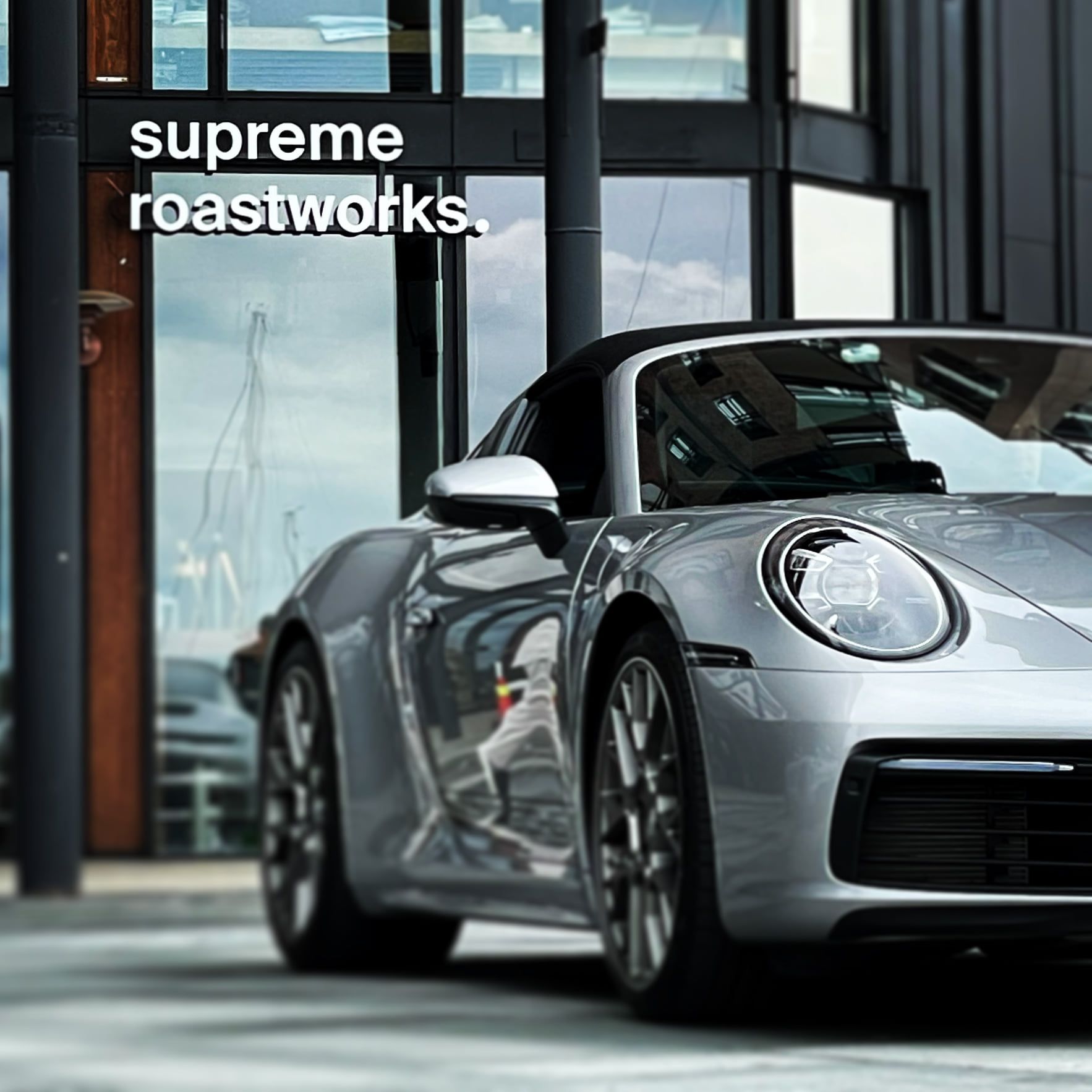 a porsche inside a showroom