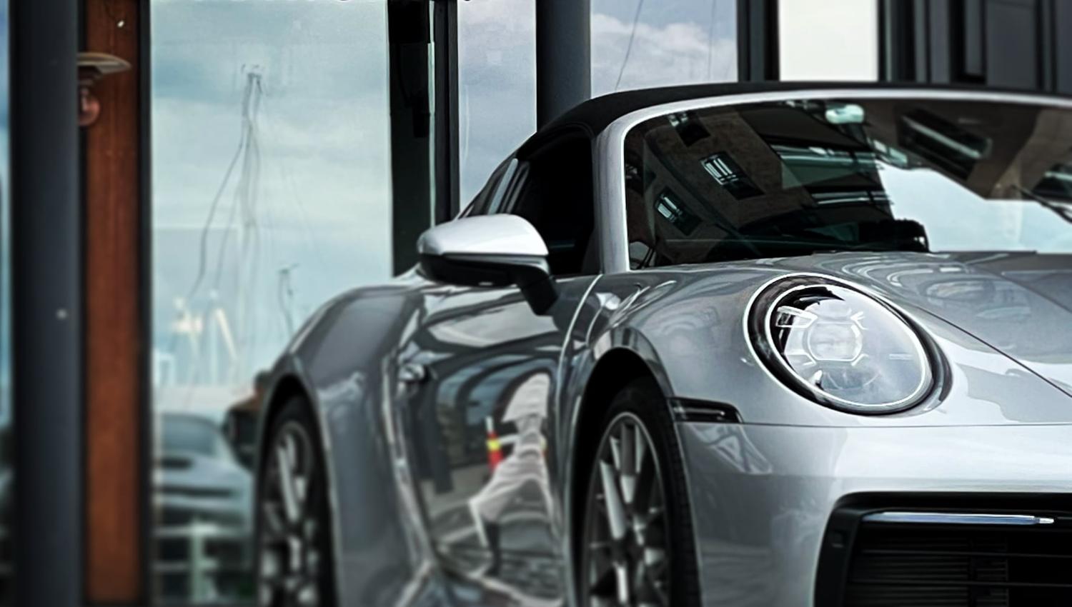 a porsche inside a showroom