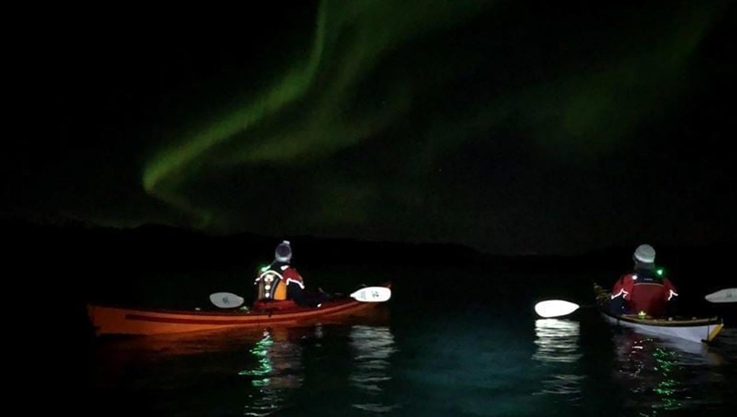Kayak trip under the northern lights