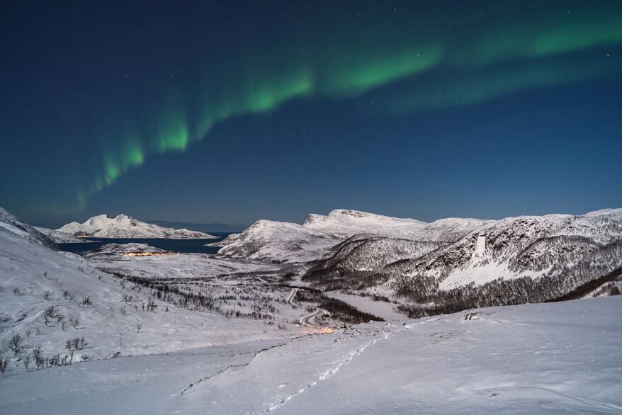 Arctic winter landscape and northern lights in the Tromso region