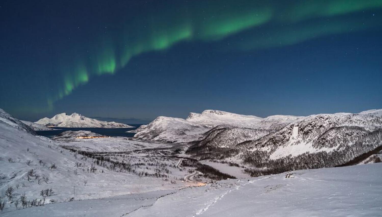 Arctic winter landscape and northern lights in the Tromso region