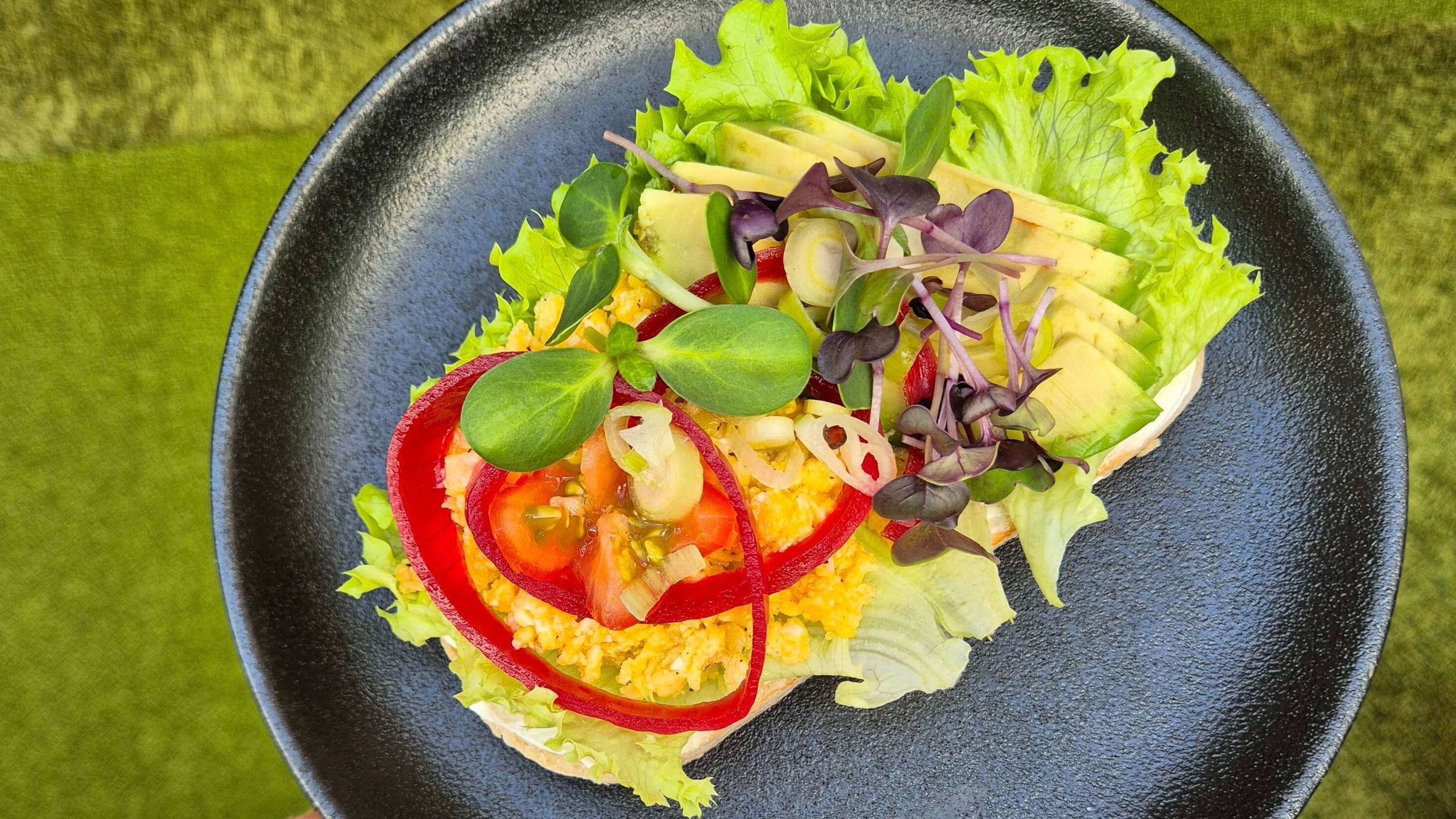 A breakfast dish with eggs and different vegetables