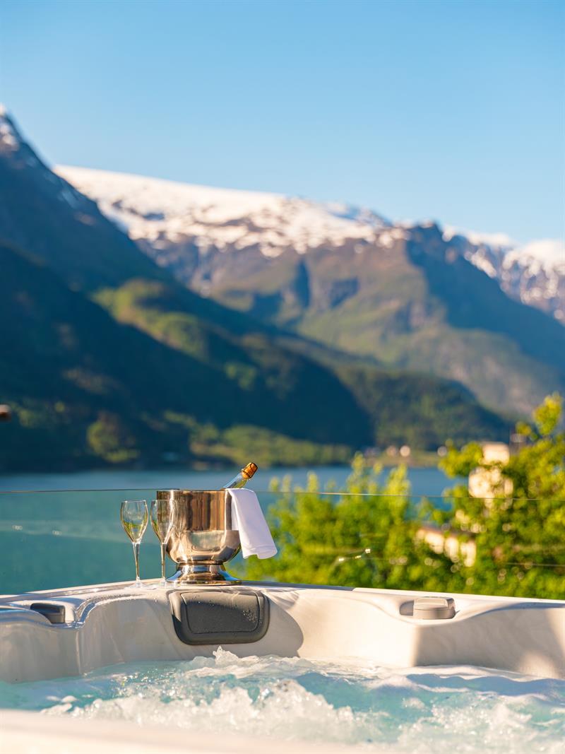 Outdoor jacuzzi at Tyssedal Hotel overlooking the Hardangerfjord.