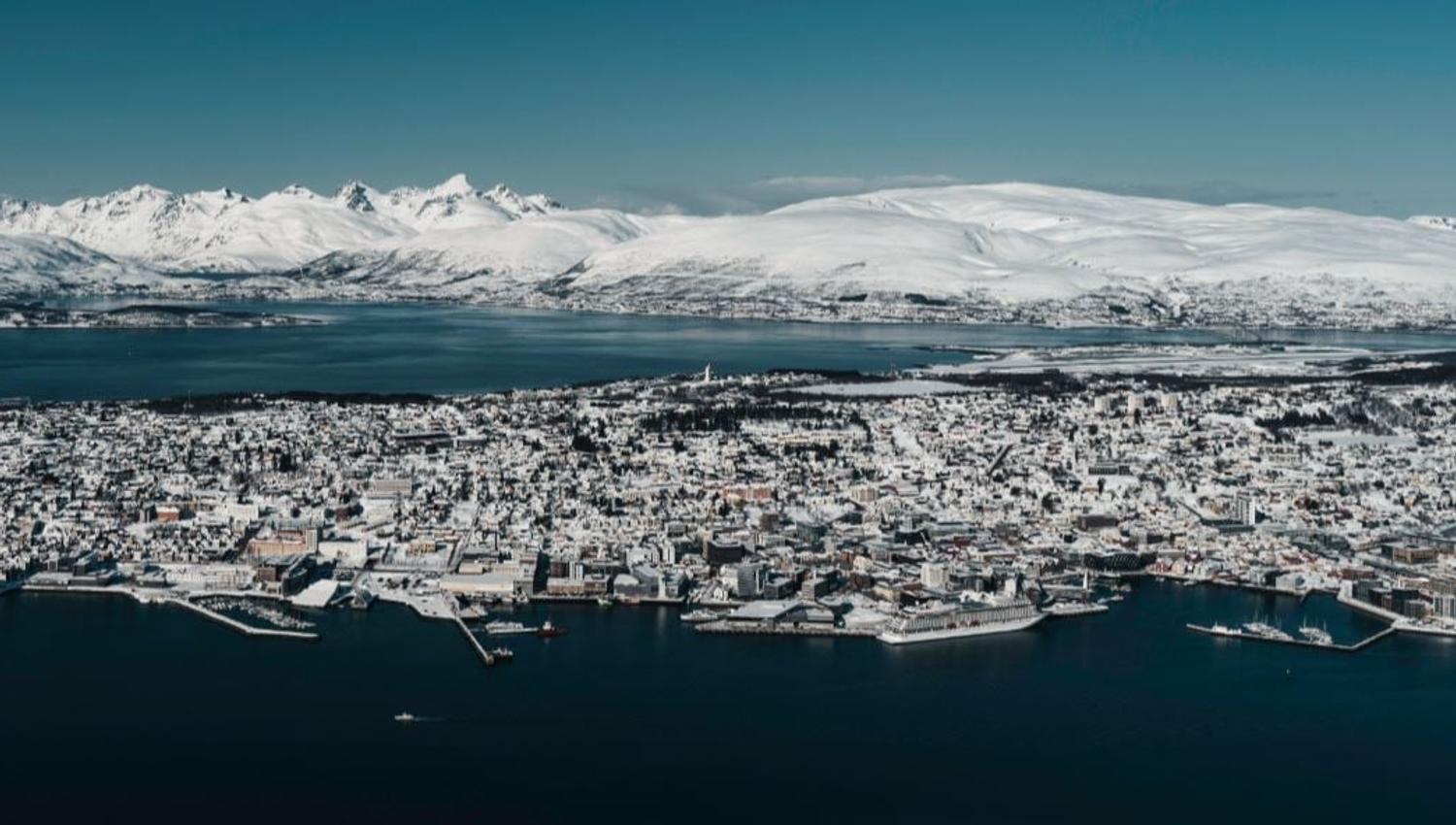 View over Tromsø with mountains and Arctic landscapes in the background.