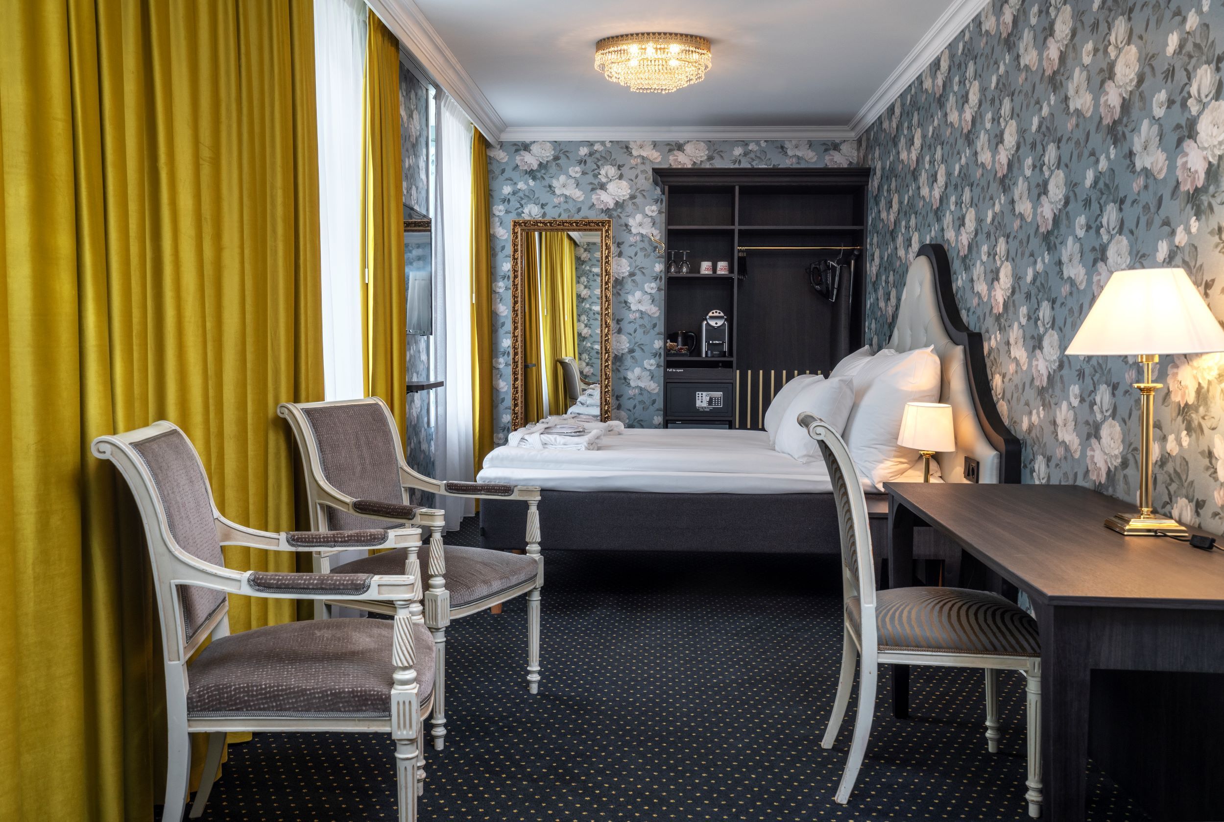Luxurious hotel room at Thon Hotel Sandven, where modern comfort meets historic elegance.