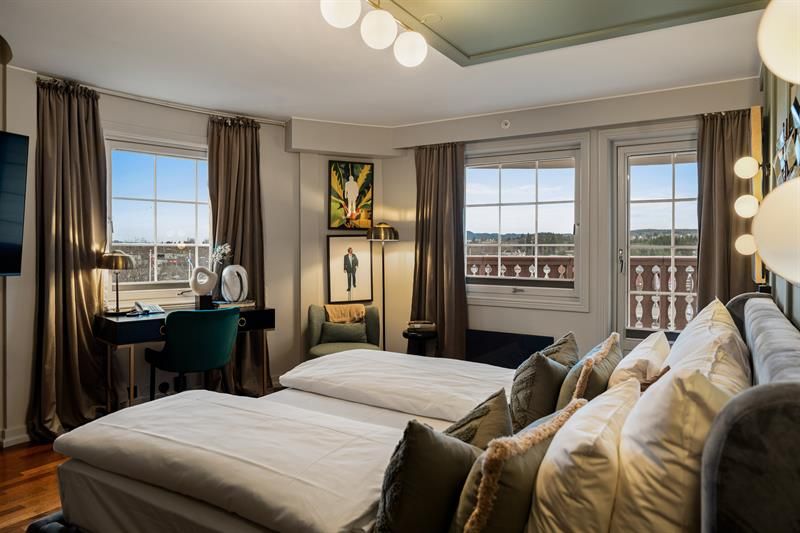 Double bed with view through windows