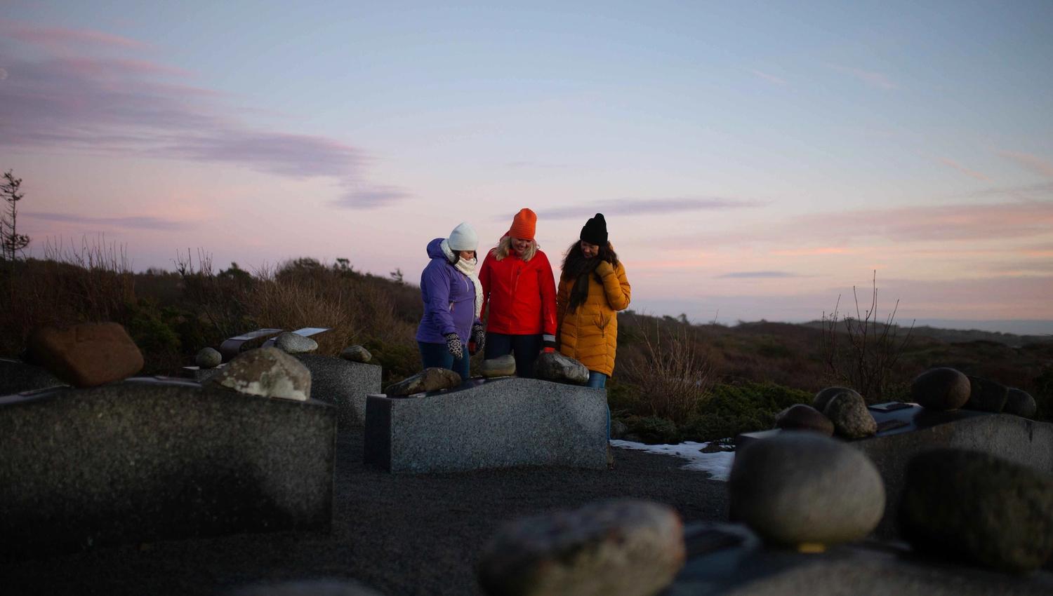 People looking at different rock types