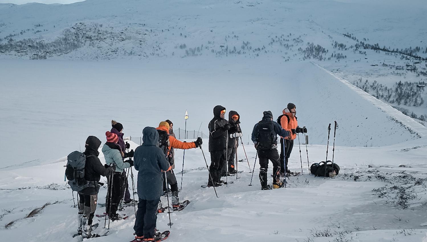 Break with the snowshoe group, enjoying the view over Hardanger.