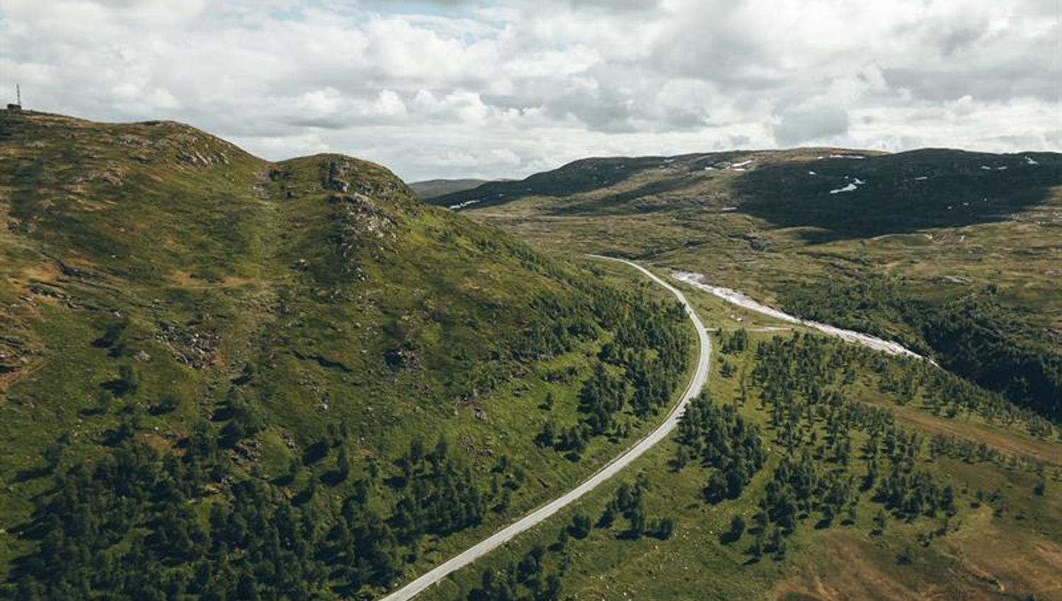 A drone shot of the access road to the dam.