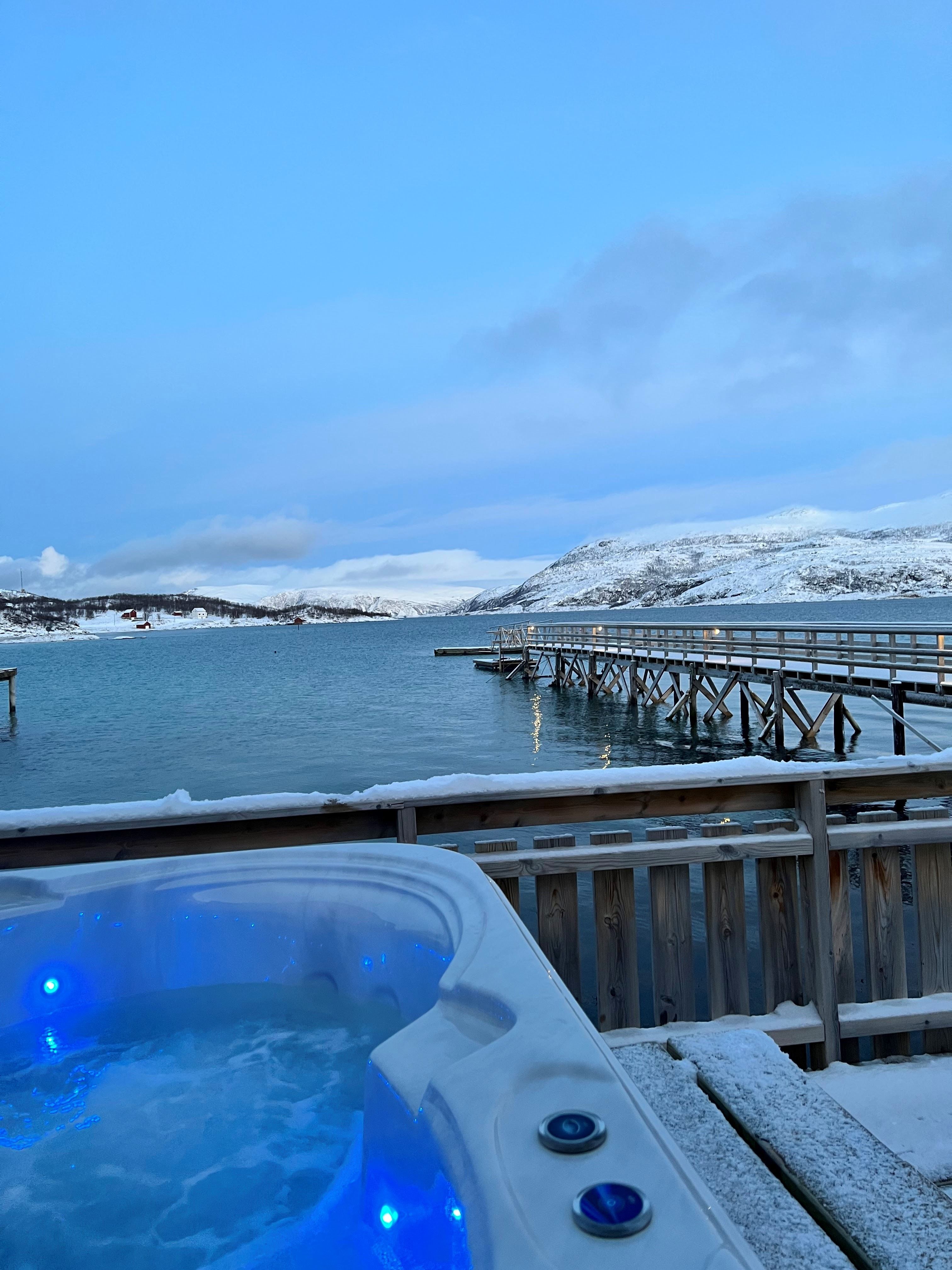 Jaquzzi during winter with views of the fjord and mountains