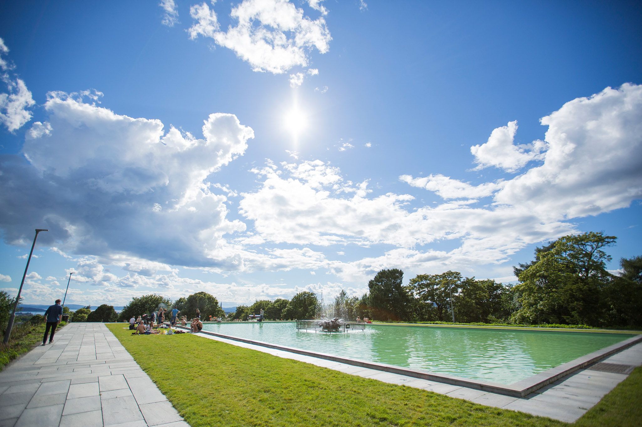 The pool with a fountain in the middle at the top of the park