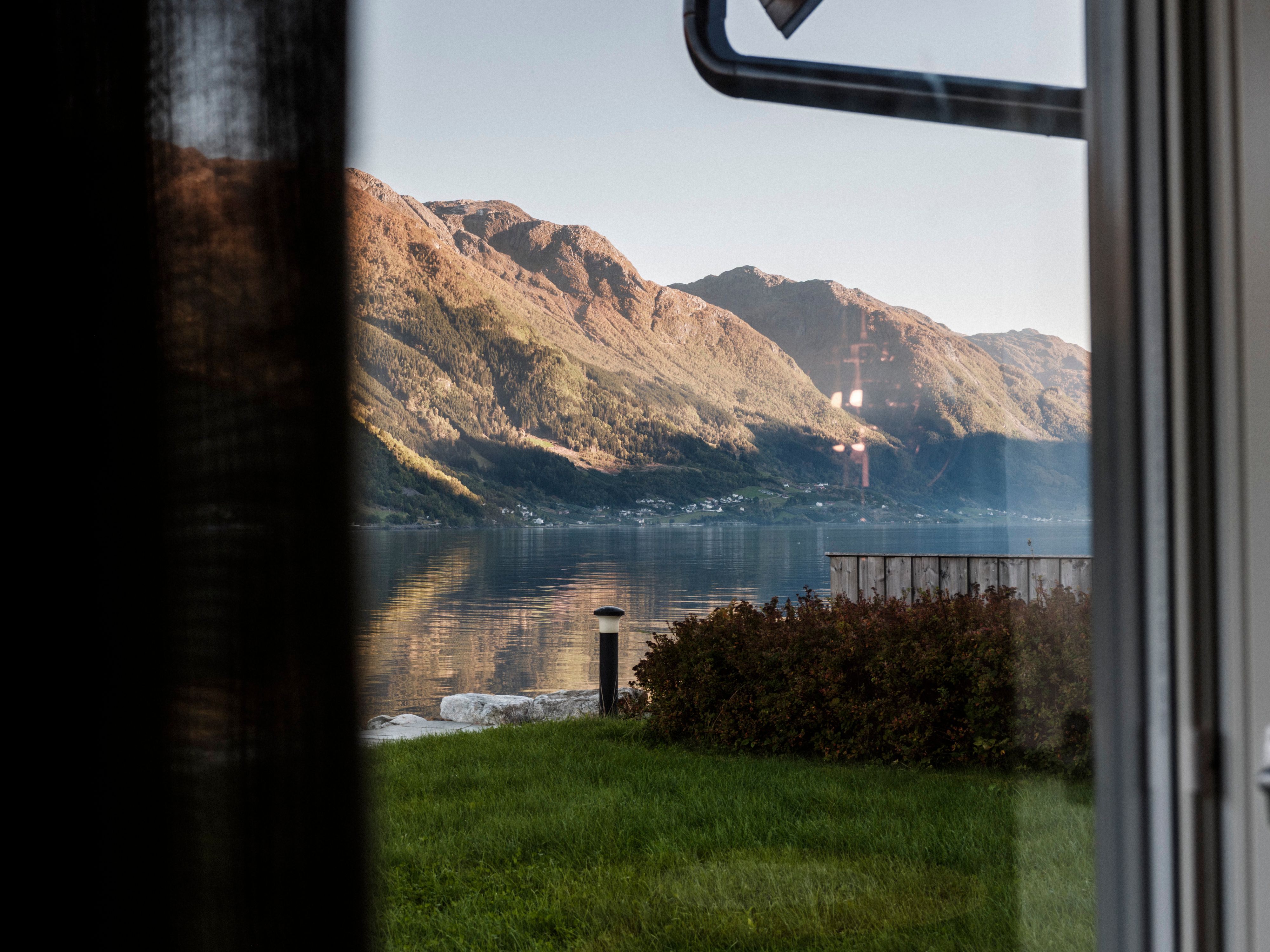 Bedroom with comfortable double bed at Aga Fjordapartments in Hardanger.