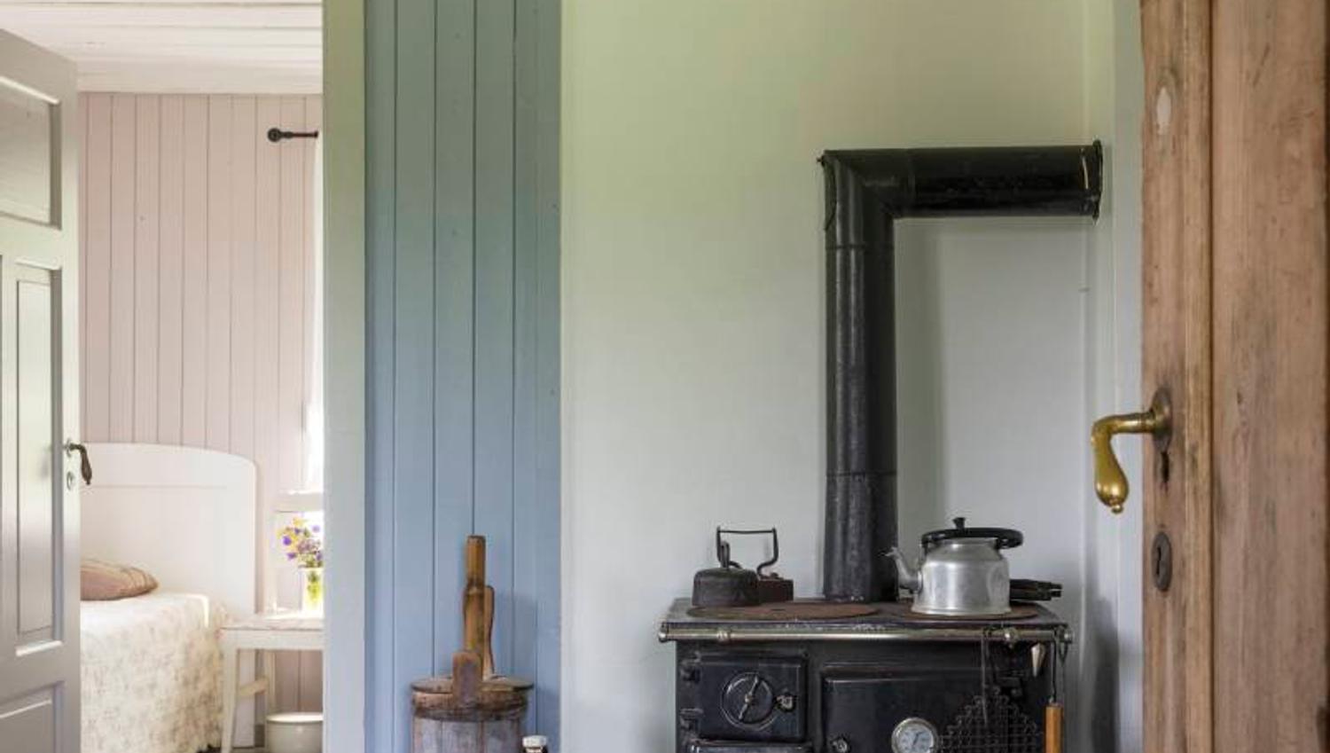 a room with an old wood stove