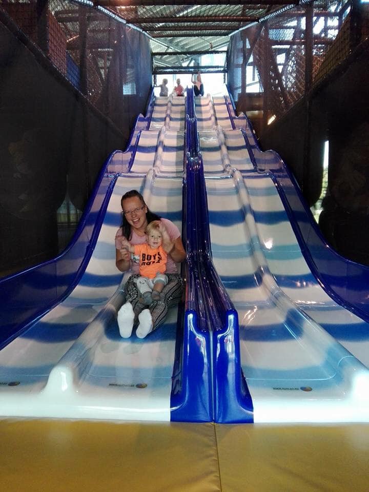 Child and mother in the slides in the playland