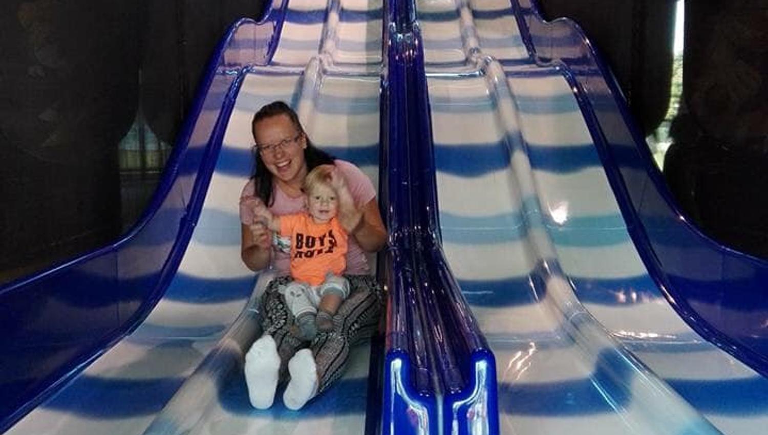 Child and mother in the slides in the playland