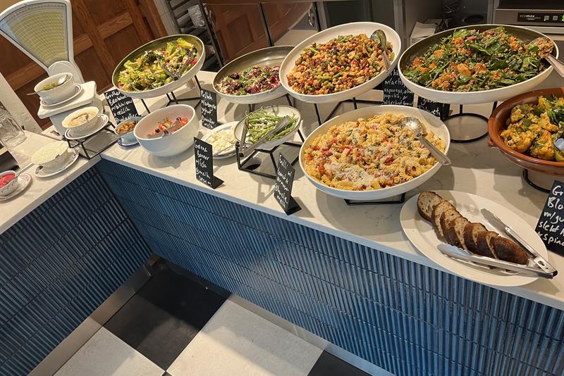 Buffet table with various dishes on