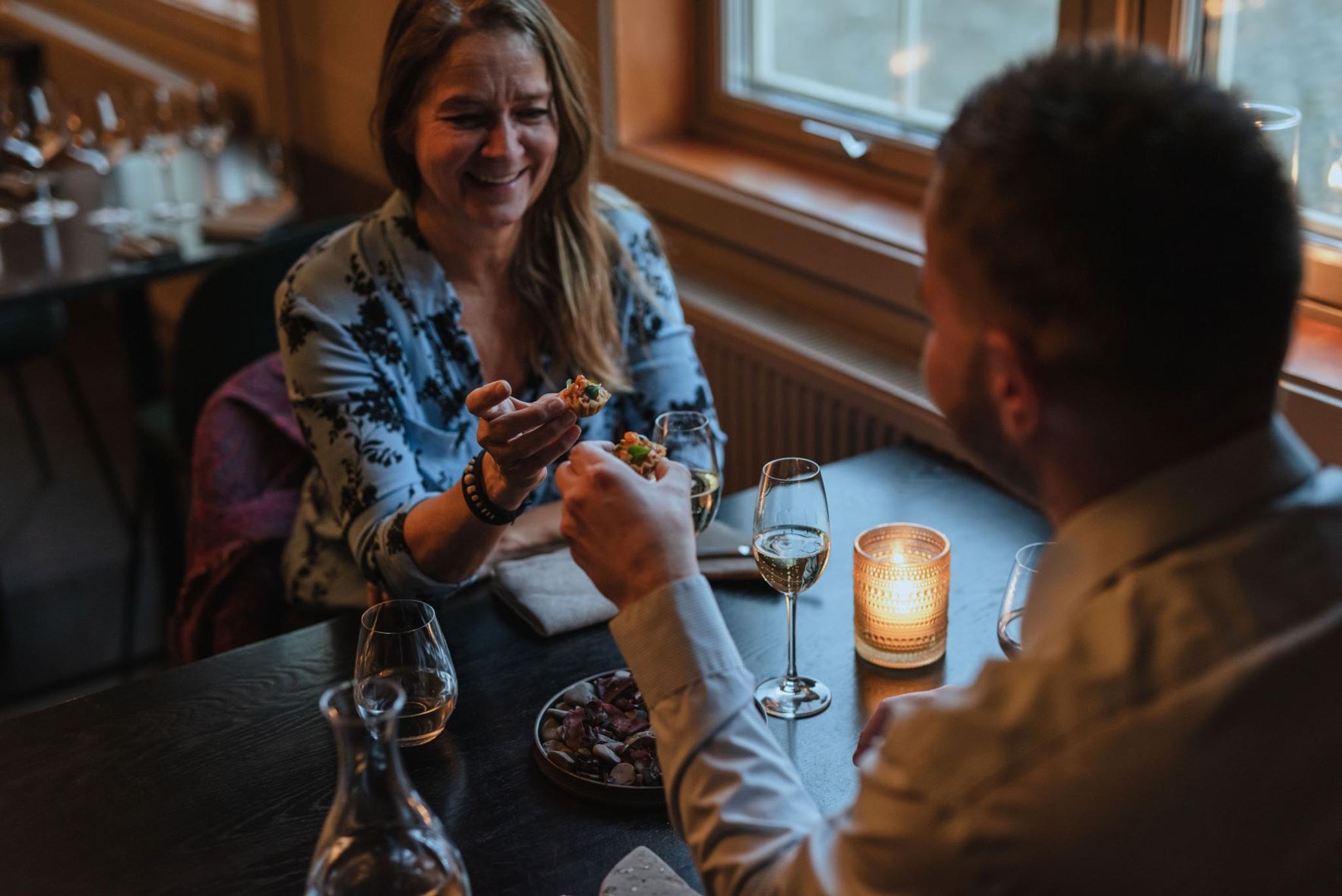 Two persons eating together at a table