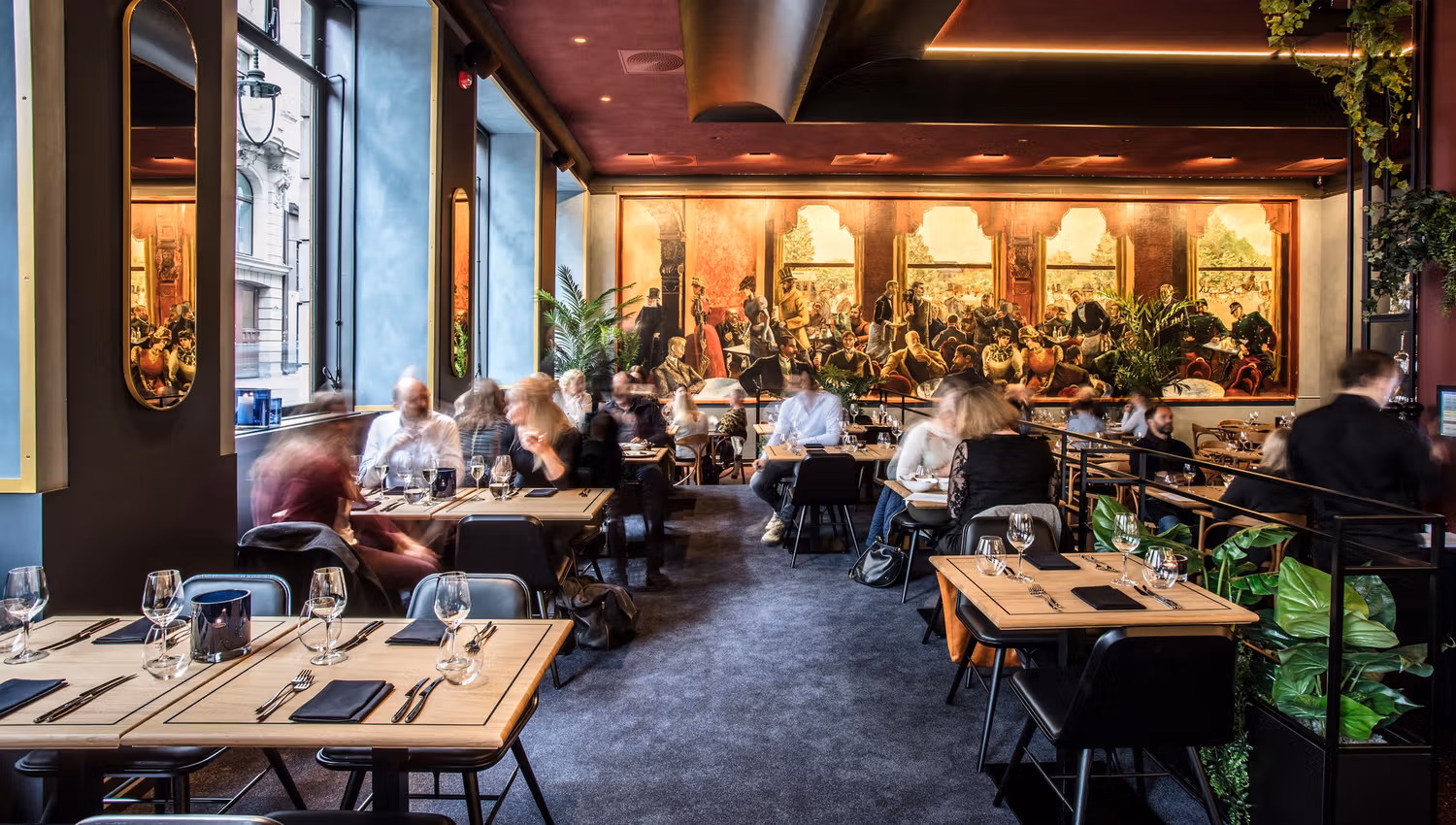 Interior of Grand Café woth people dining.