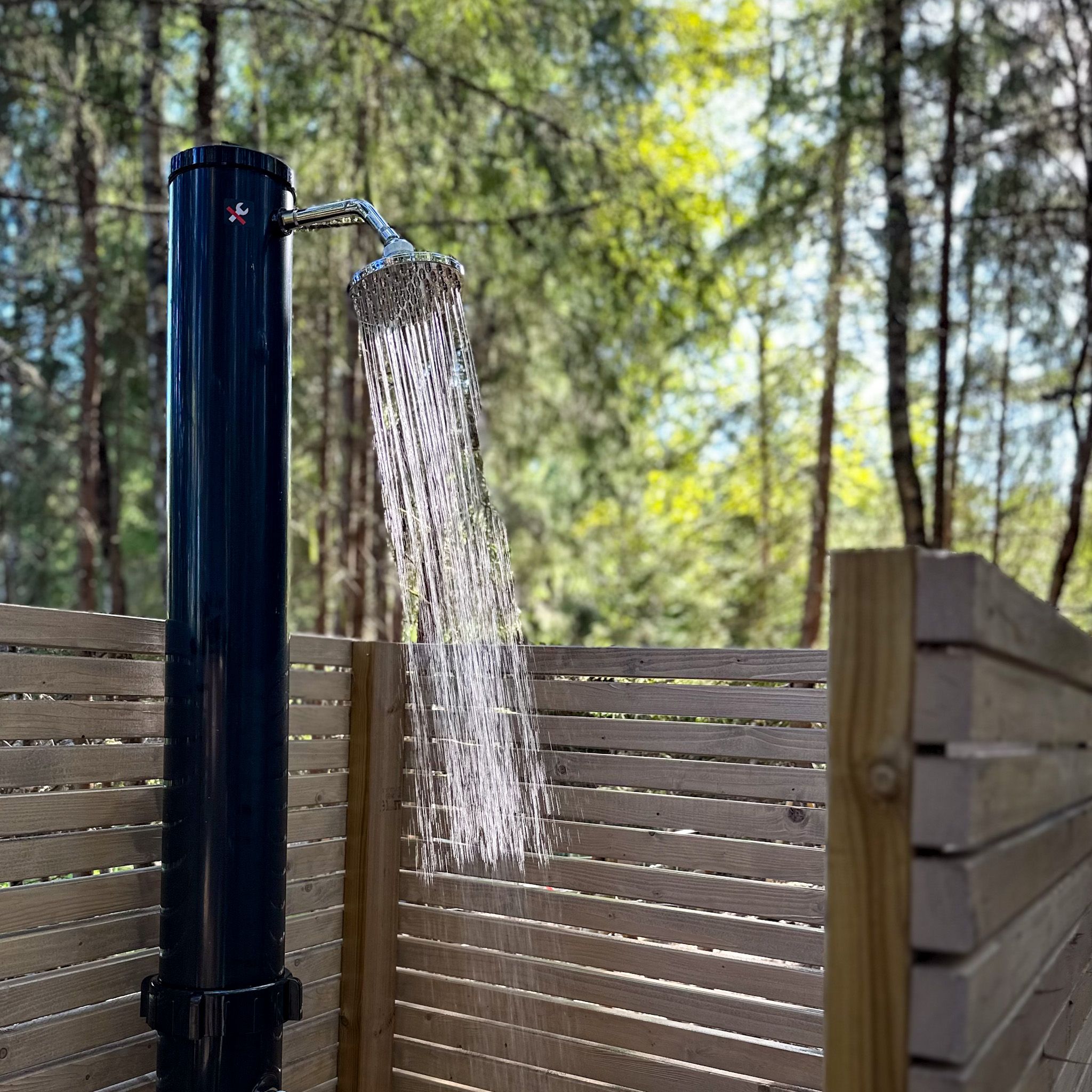 Outdoor shower with fence around