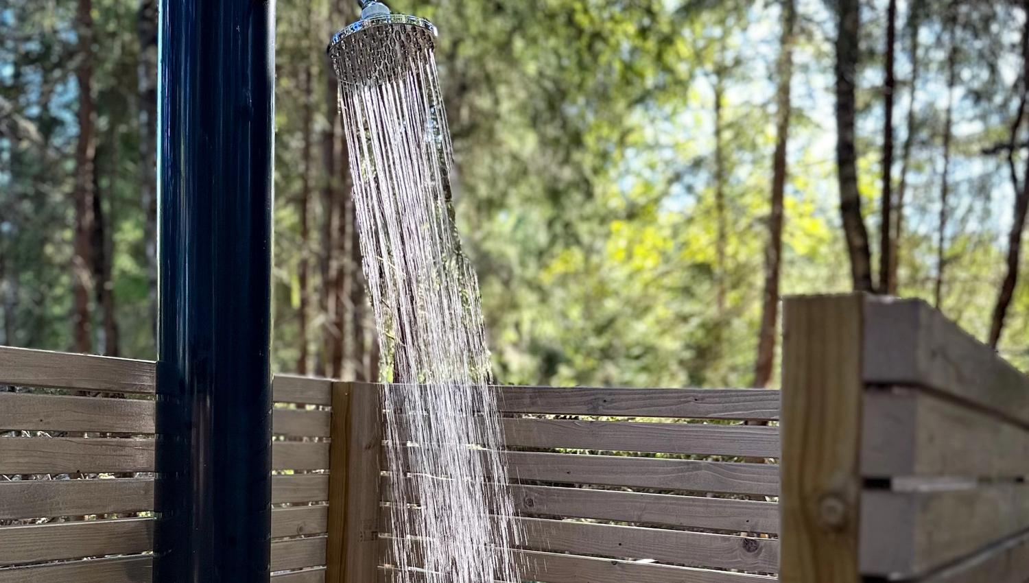 Outdoor shower with fence around