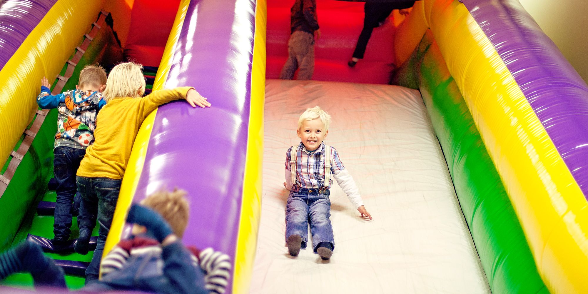 Lykkeland a play centre in Steinkjer - girl going down the slide